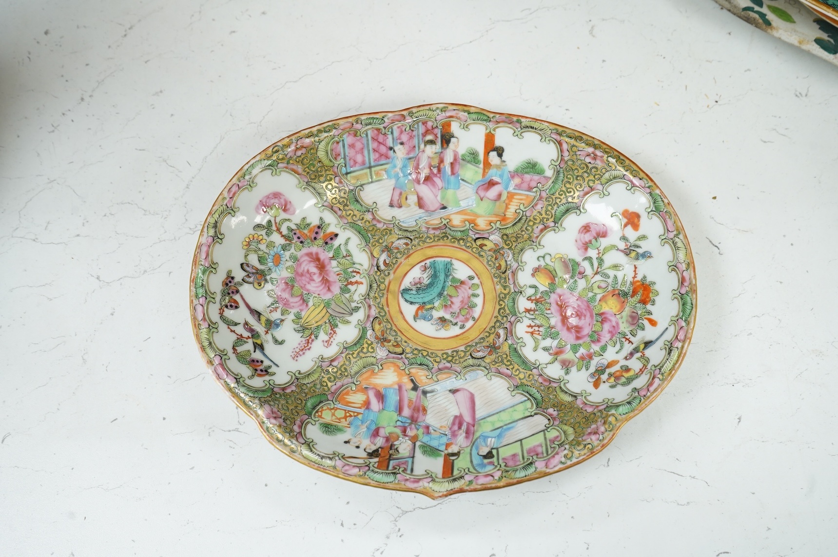 A 19th century Canton dish enamelled with figures and flowers, 27cm wide